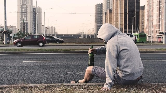 Drining beer sitting on curb Slapping ’racist’ labels on cities unfair, simplistic