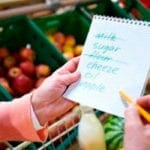 Checking a grocery list in the store
