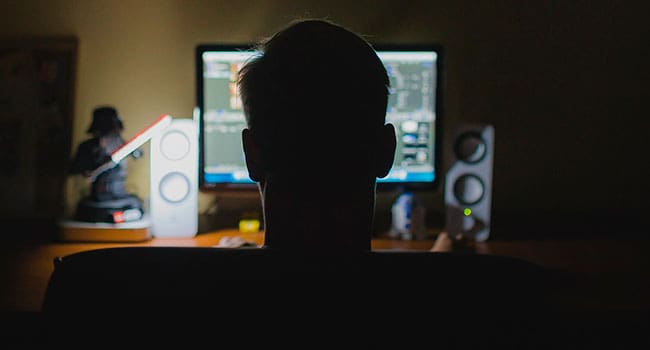 Working in the dark on a computer How far should we go to stop the social media chaos?