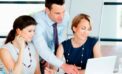 Office workers staring at computer The Pygmalion factor: Ensuring your employees’ success