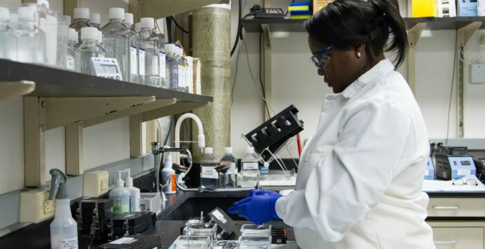 woman standing in front of the sink Get science out of the lab and onto the street to save lives